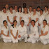 Twenty-two of the 24-member graduating class pose for a group photo.